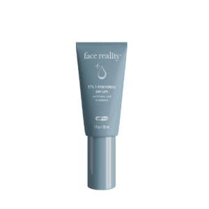 A gray tube of skincare product labeled 'face reality' with a silver cap.