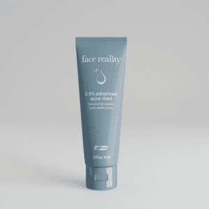 Tube of face moisturizer with shea butter on a plain background.