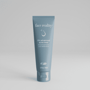 A blue tube of face wash with minimalist design on a gray background.