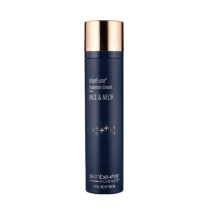 Elegant dark blue bottle of anti-aging face wash with gold cap.