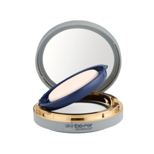 Compact makeup powder with a mirror and applicator sponge.