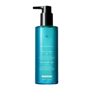 Blue bottle of facial cleansing oil with a pump dispenser.