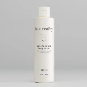 A white bottle of Face Reality super face and body serum on a gray background.