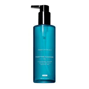 Blue pump bottle of facial cleanser with white text.