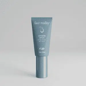 Gray cosmetic tube with silver cap on a plain background.