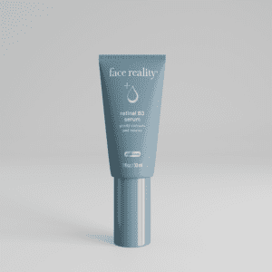 Gray cosmetic tube with silver cap on a plain background.